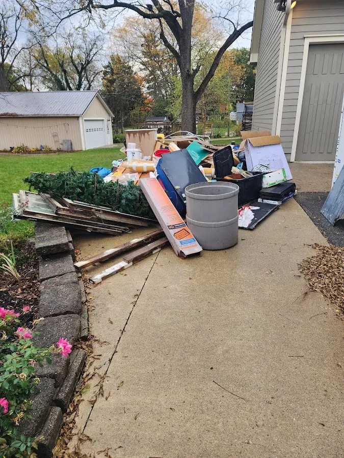 Dumpster being loaded with debris for Residential Dumpster Rental in South Chicago Heights